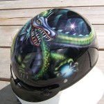 “Joss” for Bruce. The dragon was designed by Bruce’s 12 year old grandson, Joss... and I painted it on his helmet. 2 of 3